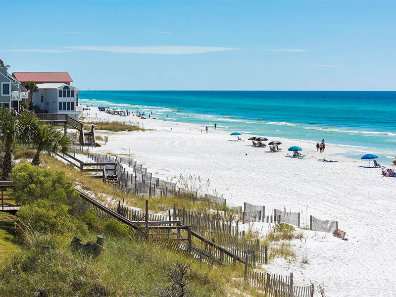 A photo of vacationers enjoying the beach near our Dune Allen, FL, rentals.