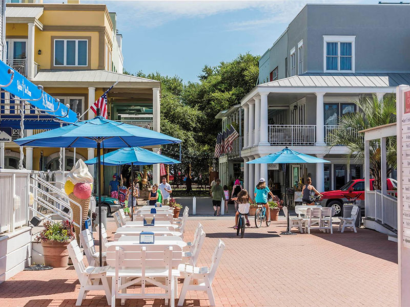 Modern coastal vacation rentals in Seaside, FL, with shopping nearby.