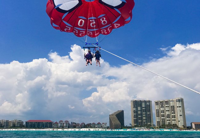 A Dip with the Dolphins Morning Parasailing in Miramar Beach near our vacation rentals