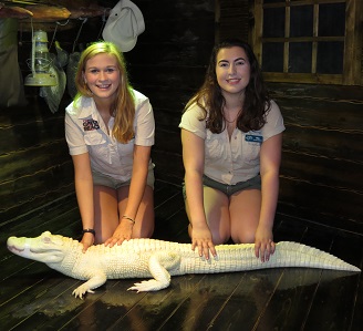 Two girls with white aligator