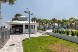 The resort-style pool and private dock overlooking Allen Lake. 30A Fish Camp has one of the largest private pools in Dune Allen Beach.