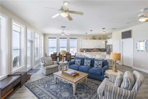 Big windows in living area overlook the water