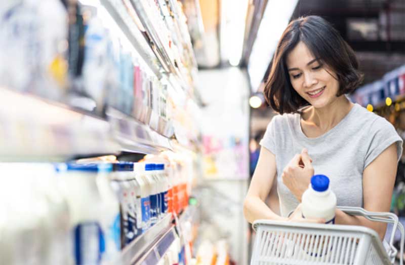 Woman shopping for groceries near her vacation rental