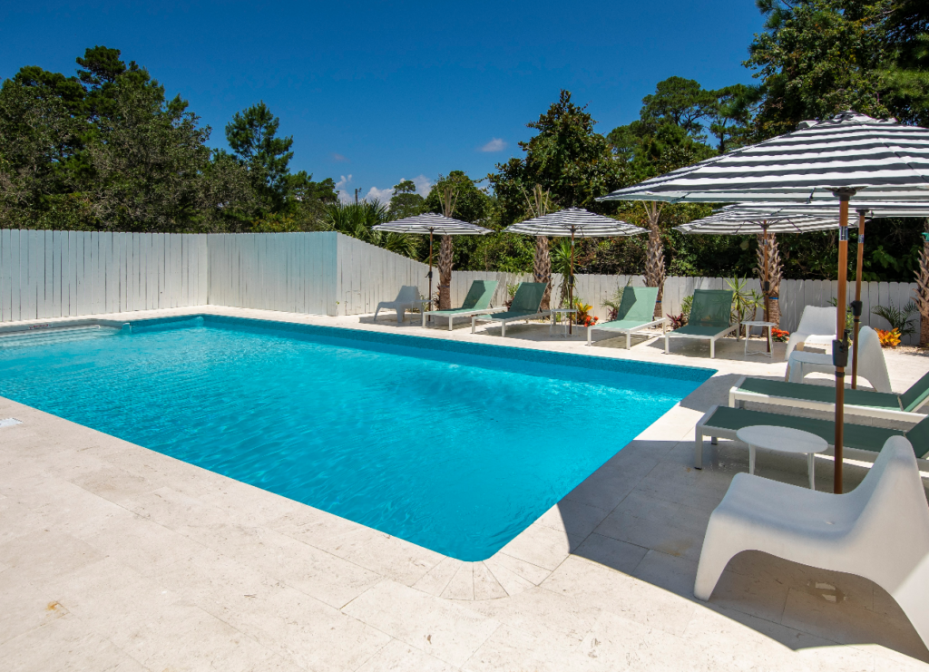 pool with nice deck next to vacation rentals