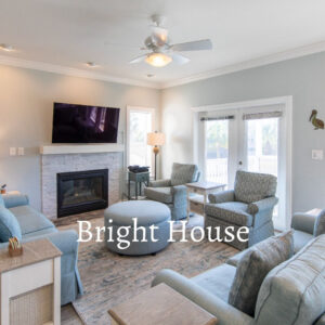 Bright House - Living room with comfortable seating, fireplace and TV.