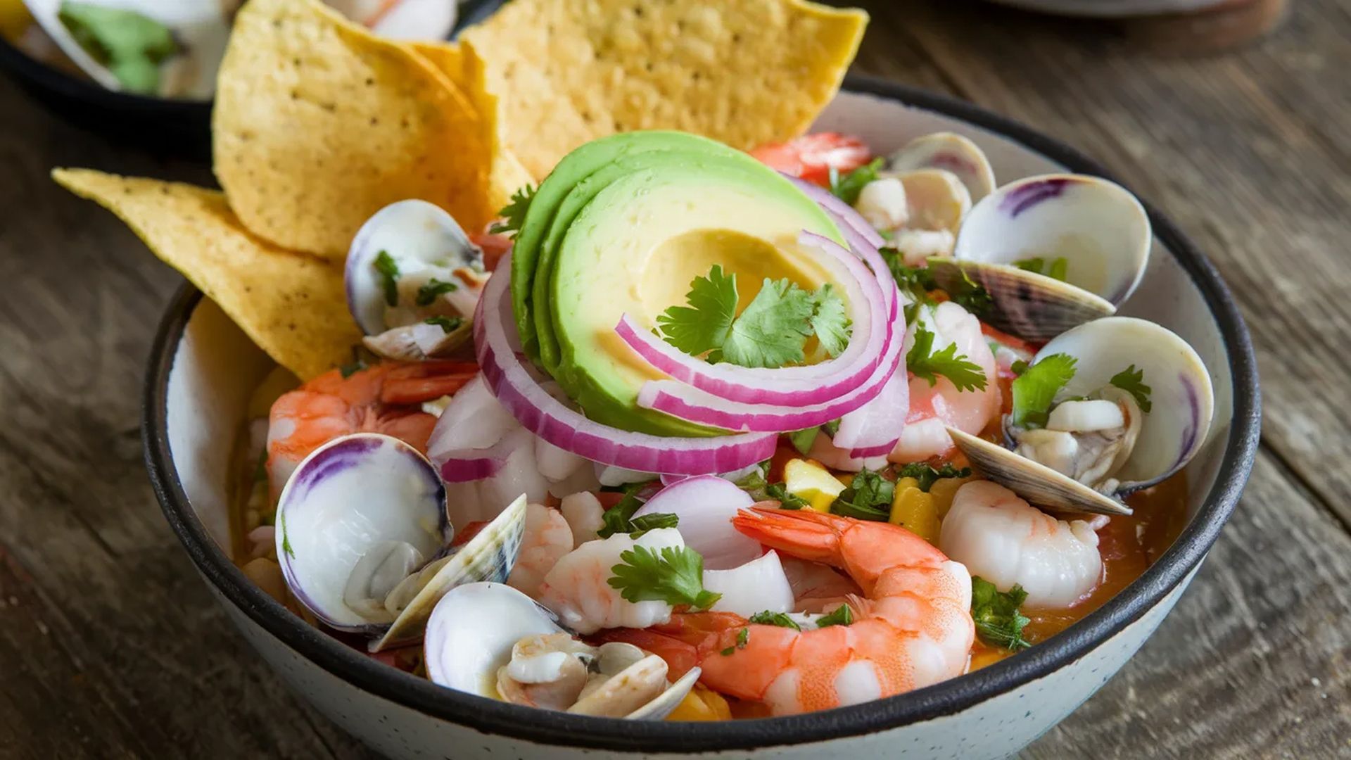 Bowl of ceviche with shrimp and chips